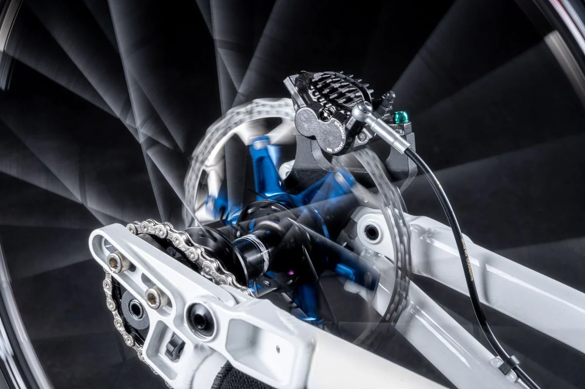 Close-up image showcasing the dynamic movement of a bicycle disk brake system in high detail.